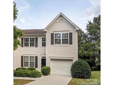 Charming two-story home with a well-maintained lawn and attached garage at 2150 Winthrop Chase Dr, Charlotte, NC 28212