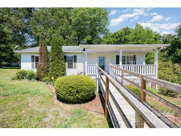 Charming single-story home with a covered porch and accessible ramp at 38367 Loblolly Ln, New London, NC 28127