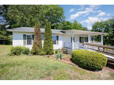 Charming one-story home with landscaped front yard, porch and accessible ramp at 38367 Loblolly Ln, New London, NC 28127