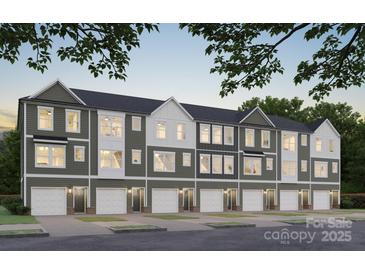 Inviting new construction townhome featuring an attached garage and neutral color scheme at 712 Drakeford Ct, Charlotte, NC 28216