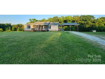 Ranch home with covered parking on a large, grassy lot at 746 Joe Lentz Rd, Salisbury, NC 28146