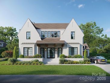 Stunning two-story white brick home with black trim, manicured lawn, and a welcoming front porch at 914 Edinburgh Ln, Charlotte, NC 28209