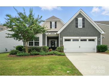 Charming home featuring a two-car garage and beautifully landscaped front yard at 10120 Berkeley Castle Dr, Charlotte, NC 28273