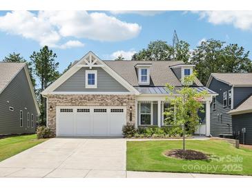 Charming home with a well-manicured lawn, three-car garage, and a blend of brick and siding accents at 3022 Trace Meadow Ct, York, SC 29745