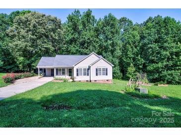 Charming single-story home featuring well-manicured lawn and covered porch at 5437 Mallard Ln, Gastonia, NC 28052
