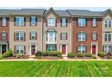 Charming townhomes with landscaped front yards and classic architectural details at 7612 Turley Ridge Ln, Charlotte, NC 28273