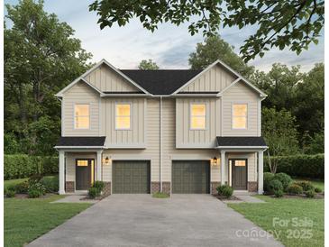 Charming new construction home with a well-manicured lawn and attached garage at 9709 Misenheimer Rd # 4A, Charlotte, NC 28215