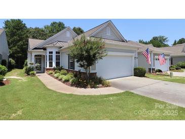 Charming home with manicured lawn, flower beds, and a two-car garage, located in a desirable community at 3079 Azalea Dr, Fort Mill, SC 29707