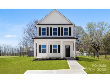 Charming two-story home with a covered porch and well-manicured front yard at 925 Marys Grove Rd, Cherryville, NC 28021