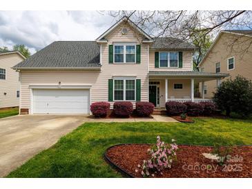 Charming two-story home features green shutters and a well-manicured front lawn at 1540 Coatsworth Ln, Rock Hill, SC 29732