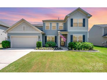 Charming two-story home with well-manicured lawn and inviting curb appeal in a desirable neighborhood at 5079 Nighthawk Dr, Fort Mill, SC 29707