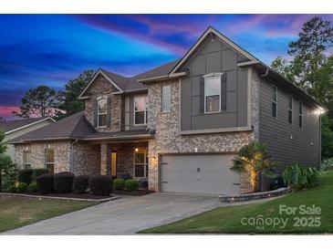 Beautiful two-story home featuring mixed material facade and attached two car garage at 1026 Arges River Dr, Fort Mill, SC 29715