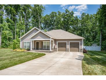Charming single-story home with a three-car garage, manicured lawn, and inviting curb appeal at 1189 Quiet Acres Rd, Rock Hill, SC 29732