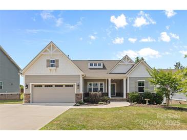 Charming single-Gathering home with a two-car garage, a manicured lawn, and stone and siding accents at 18568 Mainsail Ct, Lancaster, SC 29720