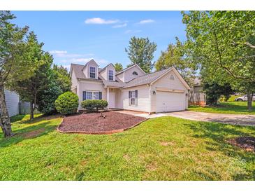 Charming home featuring dormer windows, well-maintained landscaping, and an attached two-car garage at 5417 Timbertop Ln, Charlotte, NC 28215