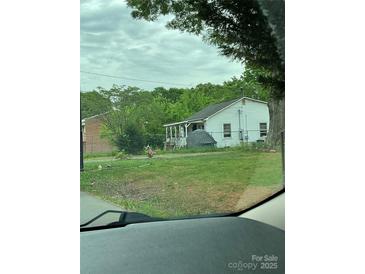 Cozy single-story home with a welcoming covered porch and ample yard space at 1024 Catawba St, Lincolnton, NC 28092