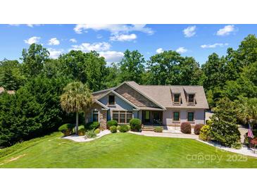 Charming home featuring a beautifully landscaped front yard and stone accents on the facade at 313 Sunset View Ct, York, SC 29745