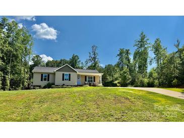 Inviting single-story home with well-manicured lawn and charming curb appeal on a sunny day at 2921 Heavners Farm Ct, Lincolnton, NC 28092