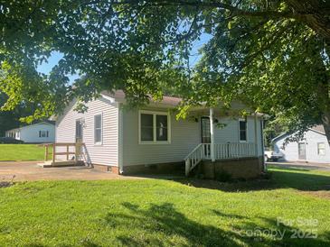 Charming home featuring a covered front porch and a well-maintained lawn at 3973 English Oak Dr, Lincolnton, NC 28092