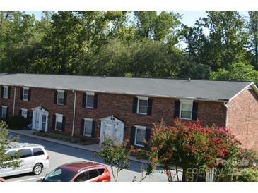 Charming brick townhomes with well-maintained landscaping and parking at 824 6Th Nw St # 5, Hickory, NC 28601