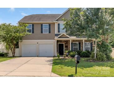 Charming two-story home featuring a two-car garage and well-maintained front yard, perfect for families at 1112 Wagner Ave # 335, Fort Mill, SC 29715