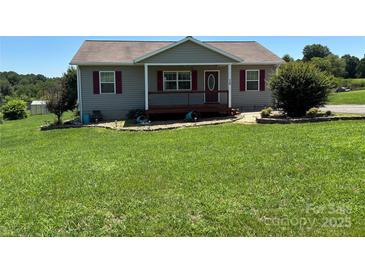 Charming single-story home with a welcoming front porch and meticulously maintained lawn at 72 Helens Way, Taylorsville, NC 28681
