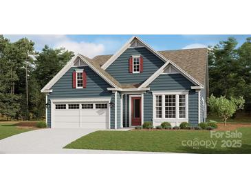 Charming single-Gathering home featuring a two-car garage, covered front porch, and red shutters at 1074 Wylie Falls Ln, York, SC 29745