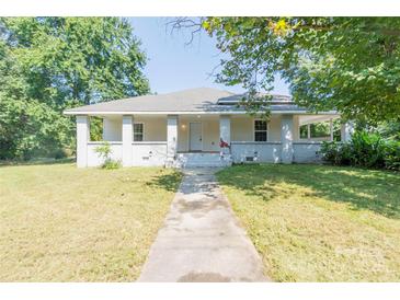 Charming single-story home with a welcoming front porch and well-maintained yard at 1818 Stowe Ave, Gastonia, NC 28054