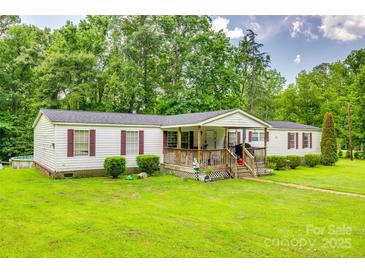 Charming single-story home with a well-manicured lawn and welcoming front porch at 10435 Silver Mine Rd, Fort Mill, SC 29707