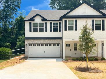 Charming new construction townhouse with a two-car garage and a manicured front yard at 3926 Litchfield Rd, Charlotte, NC 28211