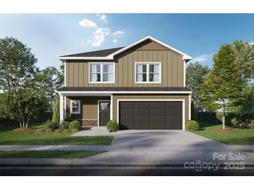 Charming two-story home featuring a classic design, complemented by lush landscaping and a two-car garage at Lot 4 Mockingbird Rd, Albemarle, NC 28001