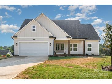 Charming single-Gathering home featuring a two-car garage and classic architectural style at 150 Autumn Blaze Rd, China Grove, NC 28023