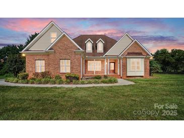 Charming brick home with a manicured lawn and inviting front entrance, perfect for families at 170 Saint James Way, Salisbury, NC 28147