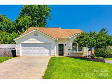 Charming single-story home featuring a well-manicured lawn and attached two-car garage at 1706 Baylor Dr, Rock Hill, SC 29732