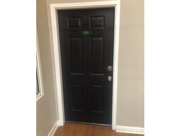 Dark, secure front door with unit number 328 at 201 S Hoskins Rd # 328, Charlotte, NC 28208