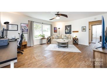Bright living room with modern decor and plenty of natural light at 2620 Park Rd # F, Charlotte, NC 28209