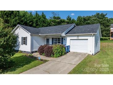 Charming single-Gathering home with white siding, black shutters, and a well-manicured lawn and a driveway at 1265 39Th Street Cir, Hickory, NC 28602