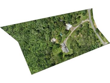 An aerial view of a secluded home and surrounding property with mature trees and long driveway at 265 River Run Rd, Statesville, NC 28625