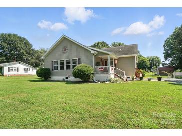 Charming single story home with a manicured lawn and inviting front porch at 29636 Lakeside Dr, Albemarle, NC 28001