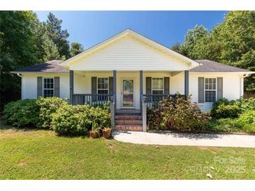 Charming home featuring a cozy front porch with lovely landscaping at 4030 Orion Rd, York, SC 29745
