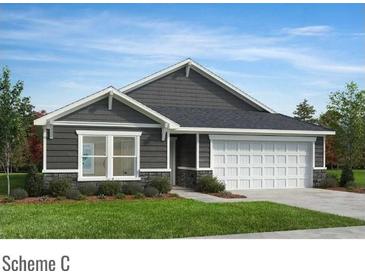 Charming single-story home featuring stone accents, horizontal siding, and a two-car garage at 4461 Family Trail Dr, Indian Land, SC 29707