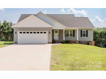 Charming single-story home with gray siding, white trim, and a spacious two-car garage at 118 Cypress Acres Ln, Statesville, NC 28625