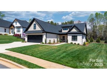 Beautiful single-Gathering home with a well-manicured lawn and attached two car garage, featuring lovely curb appeal at 4210 Holly Ne Cir, Conover, NC 28613