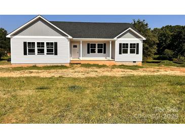 Charming single-story home with white siding, black shutters, and a well-manicured lawn at 3500 14Th Sw Ave, Hickory, NC 28602