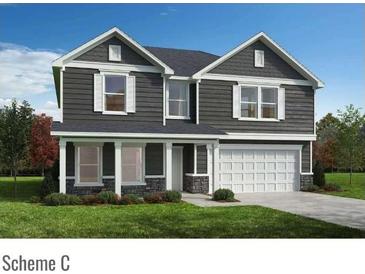 Charming two-story home with gray siding, white trim, and a two-car garage at 4453 Family Trail Dr, Indian Land, SC 29707