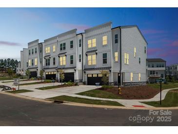 Stunning new construction townhomes with modern design and inviting curb appeal in a desirable neighborhood at 9212 Delancey Ln # 63, Concord, NC 28027