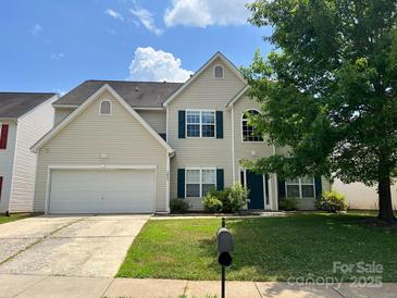 Charming two-story home with a two car garage and manicured lawn at 3022 Hendricks Chapel Ln, Charlotte, NC 28216