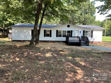 Charming single-story home with black shutters, front porch, and well-maintained landscaping at 6218 Old Pageland Marshville Rd, Marshville, NC 28103