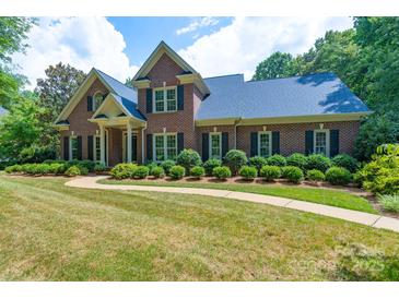 Beautiful brick home with lush landscaping and a welcoming walkway, showing its charming curb appeal at 1503 Jack White Dr, Rock Hill, SC 29732