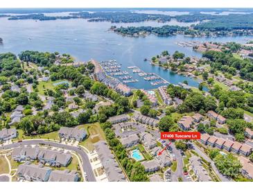 Stunning aerial view of community condos, marina, and Lake Norman in Cornelius, North Carolina at 17406 Tuscany Ln, Cornelius, NC 28031
